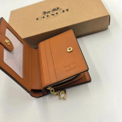 COACH X PEANUTS - Limited Edition Snoopy & Woodstock Small Zip Wallet | COACH New York Signature Canvas